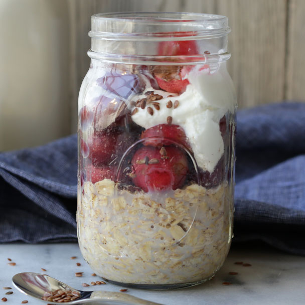cherry overnight oats with added layer of pitted cherries
